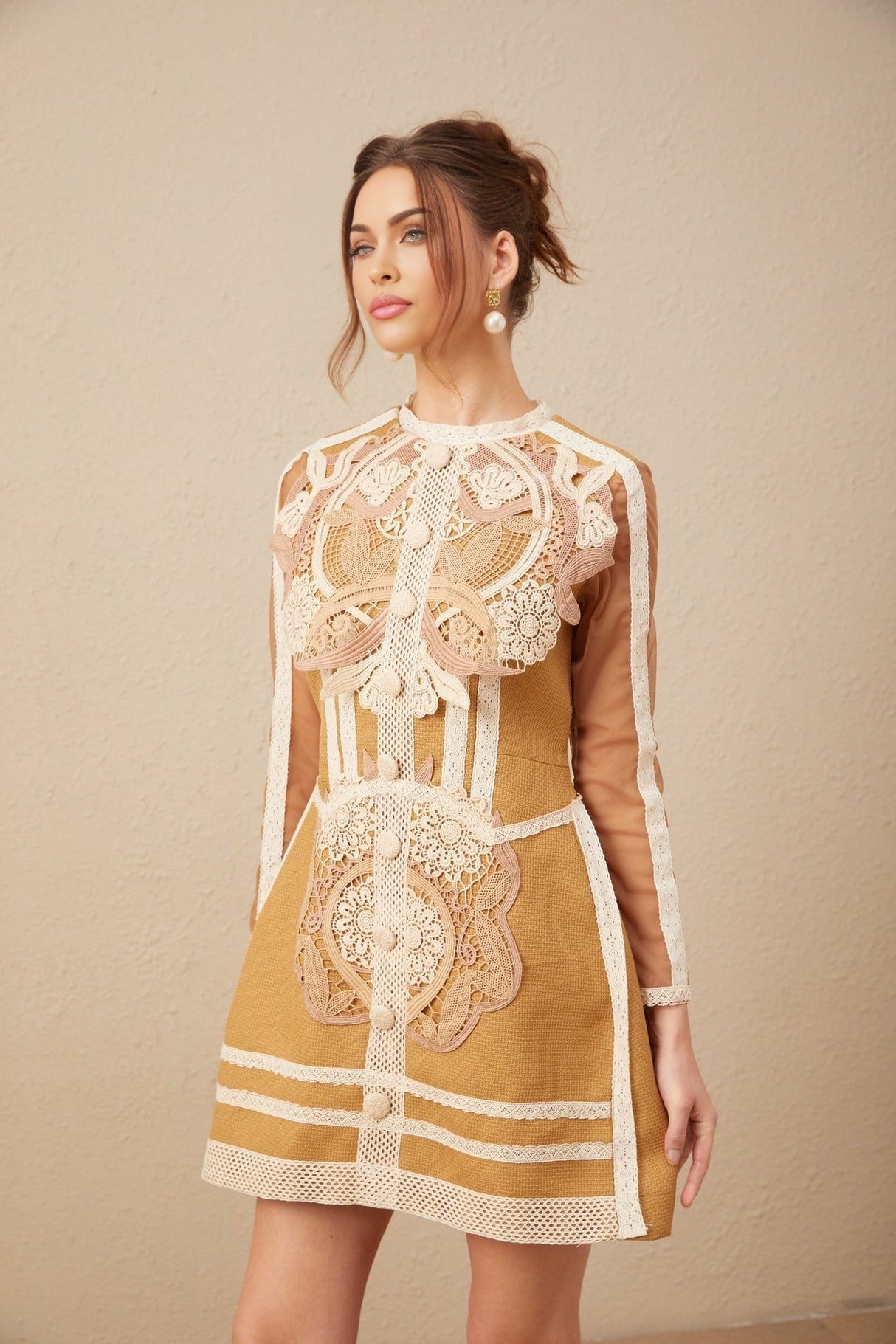 A short white lace dress with a peplum waist and cutout details featuring a fitted bodice and flared skirt