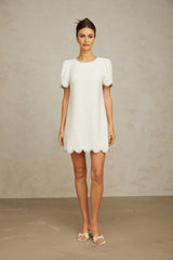 A short white mini dress adorned with crystal embellishments featuring a feminine silhouette and delicate detailing named Berenice