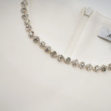 A short white mini dress adorned with crystal embellishments featuring a stylish design named Berenice