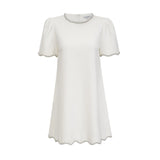 A short white mini dress adorned with crystal embellishments named Berenice