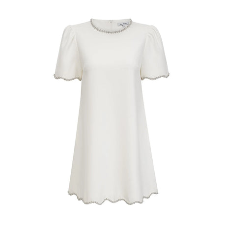A short white mini dress adorned with crystal embellishments named Berenice