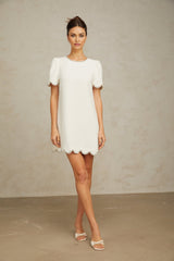 A short white mini dress adorned with crystal embellishments named Berenice
