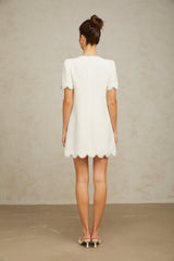 A short white mini dress adorned with crystal embellishments named Berenice
