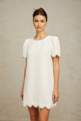 A short white mini dress adorned with crystal embellishments named Berenice