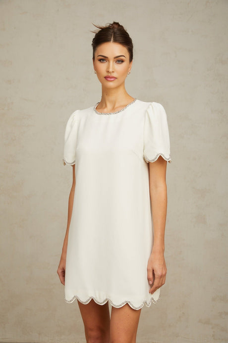 A short white mini dress adorned with crystal embellishments named Berenice