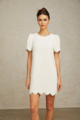 A short white mini dress adorned with crystal embellishments named Berenice