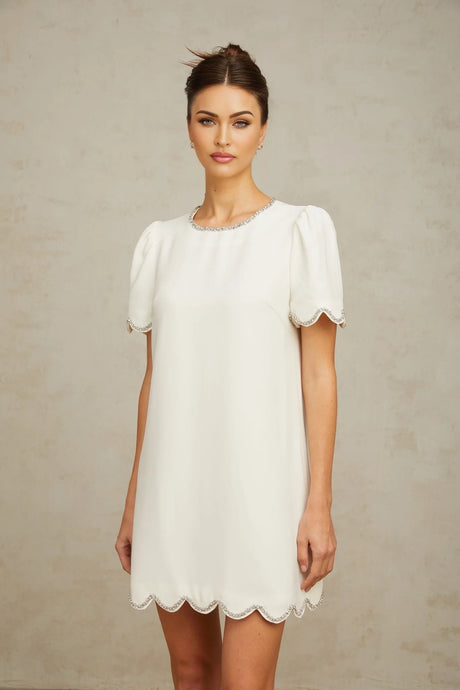 A short white mini dress adorned with sparkling crystal embellishments named Berenice