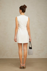 A short white mini dress with a delicate floral pattern and crystal embellishments featuring a feminine silhouette and intricate flower motif design