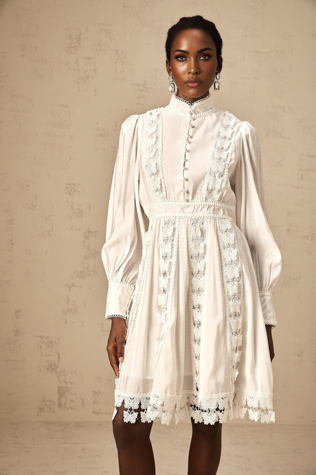 A short white mini dress with butterfly appliques decorating the fabric