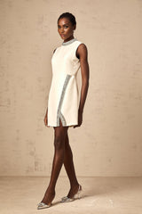 A short white mini dress with crystal embellishments named Babette
