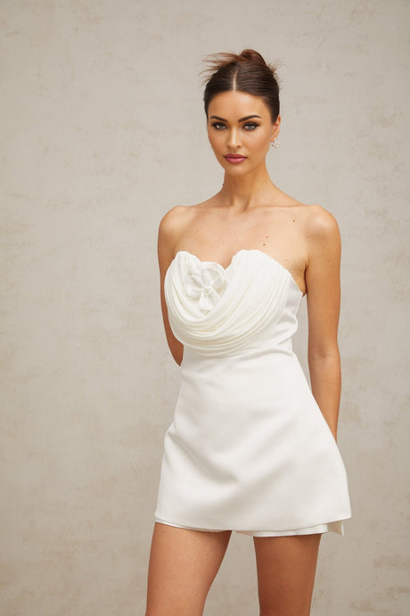 A short white mini dress with floral applique details named Lucie