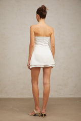 A short white mini dress with floral applique details named Lucie