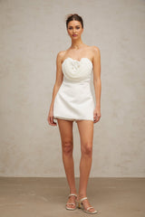 A short white mini dress with floral applique details named Lucie
