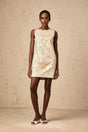 A short white mini dress with intricate embroidery and bead embellishments featuring delicate floral patterns and a fitted silhouette