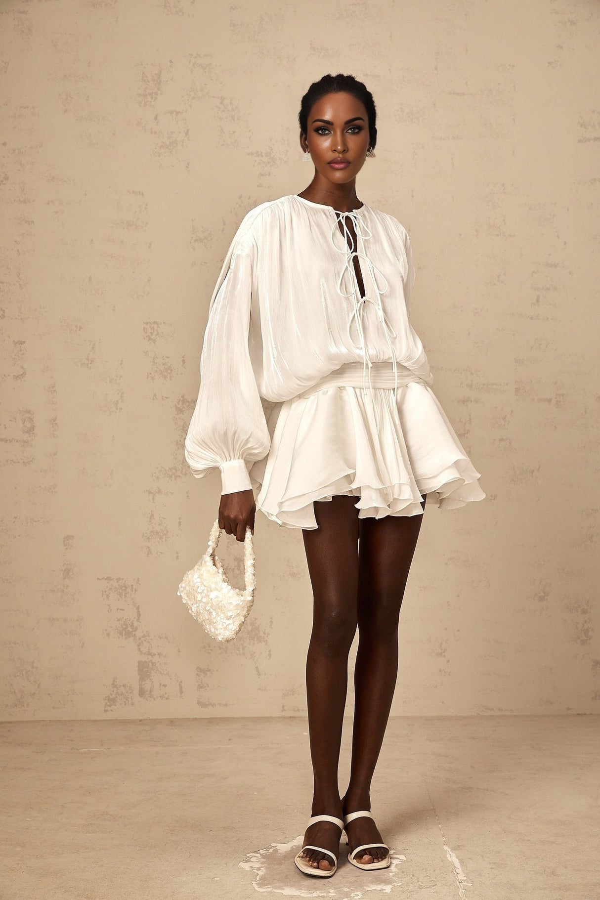 A short white mini dress with pleated fabric and glitter effect named Mahault
