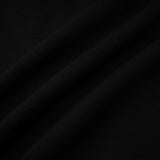 A short wool dress with colorblocked sections and ribbed texture featuring a mini length design