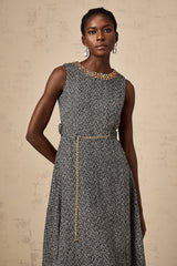 A sleeveless grey tweed midi dress with crystal embellishments for Valentines Day featuring a fitted silhouette and neutral color palette