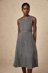 A sleeveless grey tweed midi dress with crystal embellishments suitable for Valentines Day featuring a fitted silhouette and textured fabric