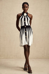 A sleeveless knitted mini dress with contrasting colors named Celeste