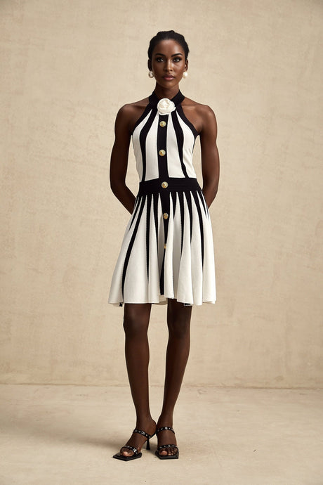 A sleeveless knitted mini dress with contrasting colors named Celeste