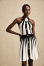 A sleeveless knitted mini dress with contrasting colors named Celeste