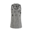 A sleeveless mini dress with a floral pattern featuring faux flowers named Nadege
