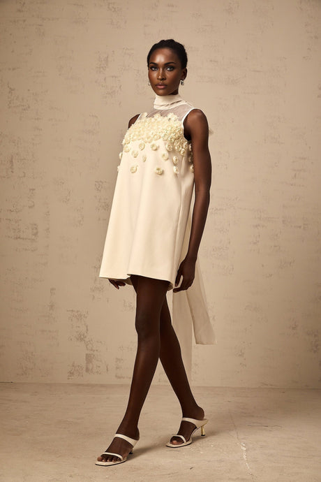 A sleeveless mini dress with faux flower decorations in a Claire style