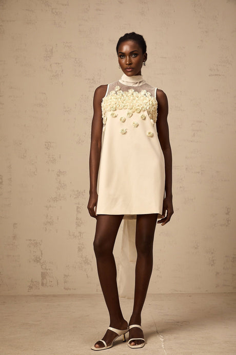 A sleeveless mini dress with faux flower details in a summery style