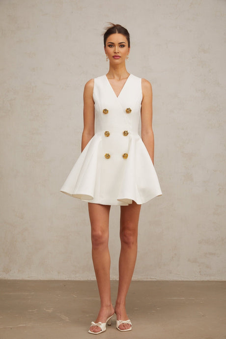 A sleeveless mini dress with pleated details and a peplum hem named Elise