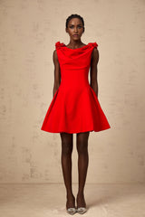 A sleeveless red mini dress with faux flower details on a mannequin or model against a plain background