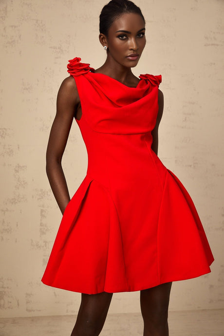 A sleeveless red mini dress with faux flower embellishments modeled on a female figure against a plain background
