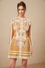 A sleeveless white lace mini dress with cutout details and a peplum waist featuring delicate floral patterns throughout