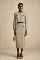 A stylish gold tweed jacket and skirt set with sequin embellishments featuring a matching ensemble for an elegant look