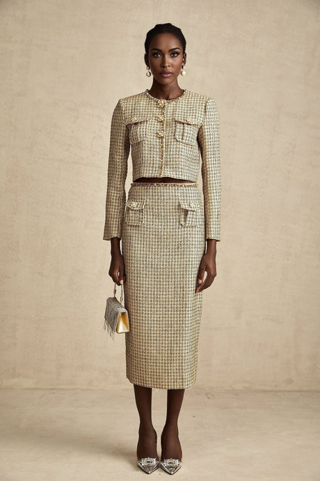 A stylish gold tweed jacket and skirt set with sequin embellishments featuring a matching ensemble for an elegant look