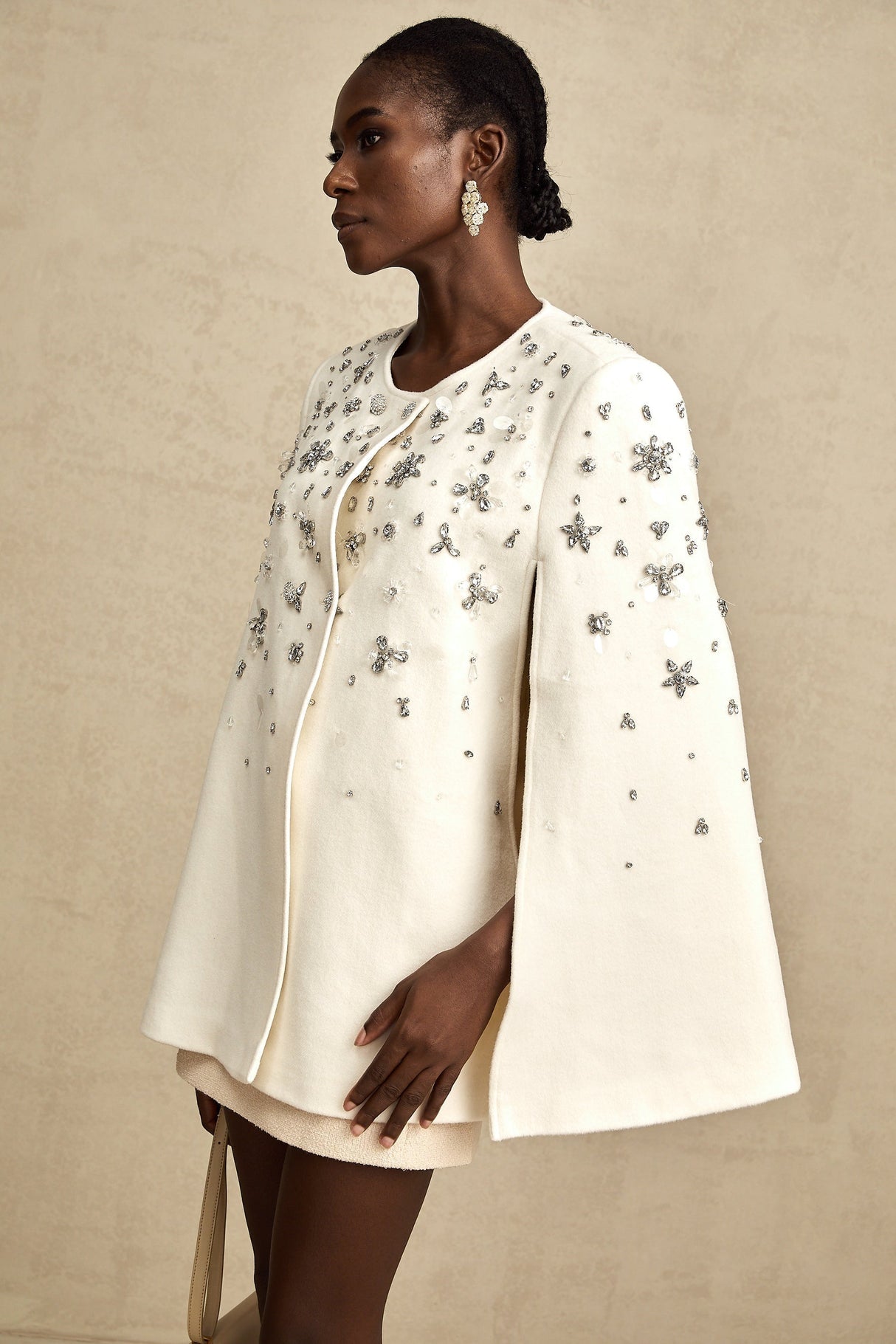 A stylish jacket with capelike design featuring embellishments named Eleonore
