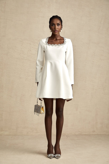 A white Aline mini dress with crystal embellishments named Angelique