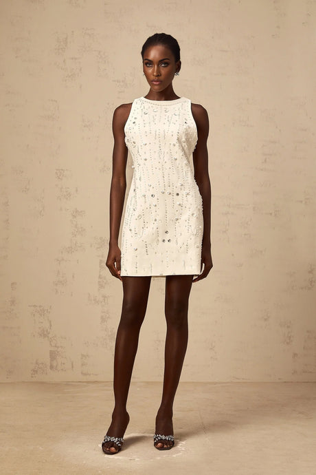 A white Aline mini dress with embellishments named Flavie