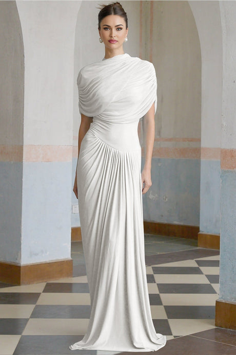 A white asymmetric maxi dress with pleated details and a long flowing skirt worn by a model