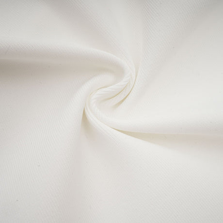 A white bandage dress with an oversized bow detail featuring a formfitting silhouette and sleeveless design named Capucine
