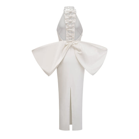 A white bandage dress with an oversized bow detail named Capucine featuring a formfitting silhouette and elegant design