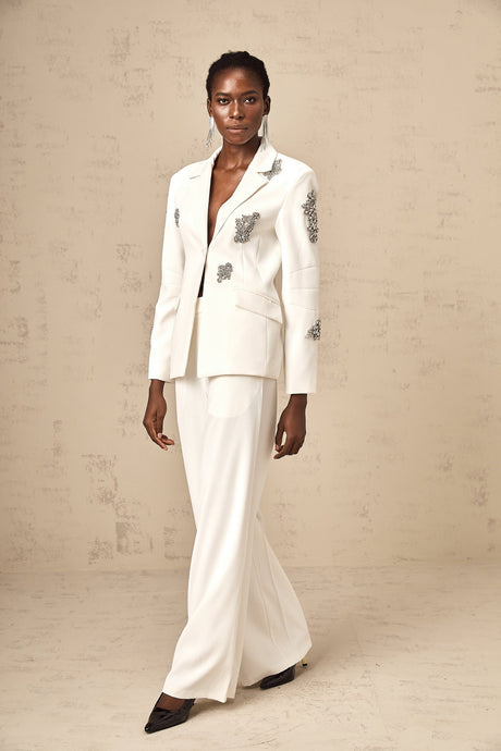 A white blazer and trouser set adorned with crystal embellishments named Edvige stylish formal attire for women
