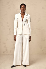 A white blazer and trouser set embellished with crystal details Edvige matching outfit for formal occasions