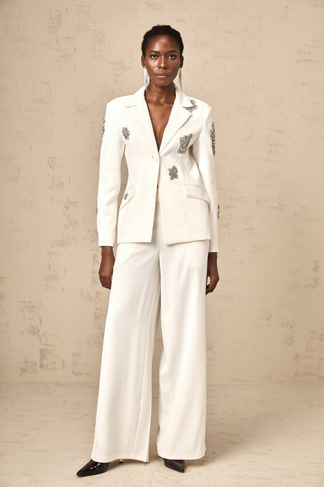 A white blazer and trouser set embellished with crystal details Edvige matching outfit for formal occasions