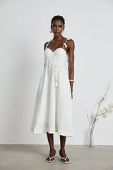 A white corset midi dress with a fitted bodice and flared skirt named Helene