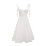 A white corset midi dress with a fitted bodice and flared skirt worn by a model against a plain background