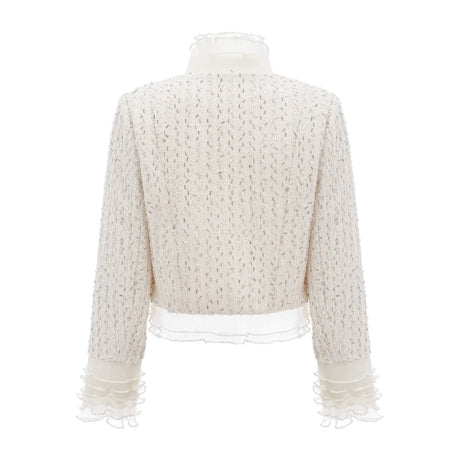 A white cropped jacket with beaded embellishments and ruffled details named Blanche