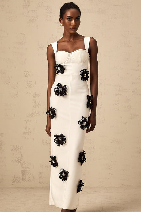 A white floorlength bandage dress with floral applique details named Olivia