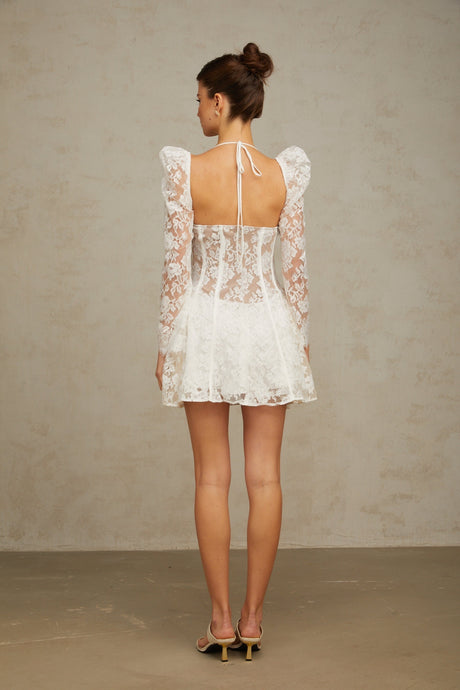 A white floral lace mini dress with a corset style bodice featuring a sweetheart neckline and short skirt