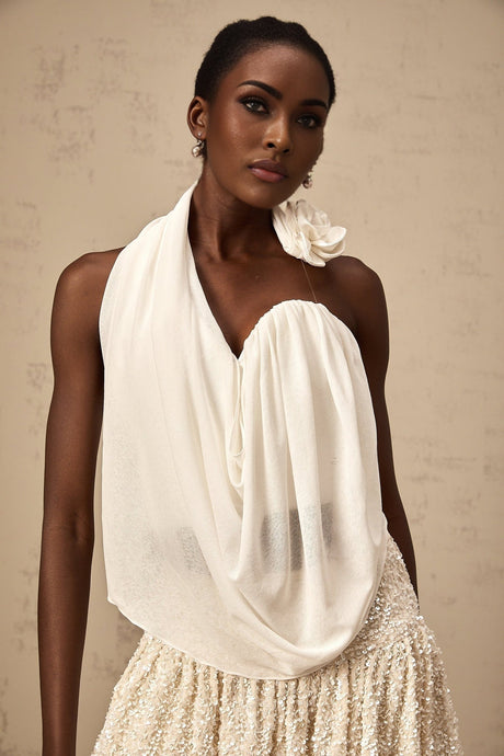 A white halterneck top with floral appliques named Maeva