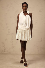 A white halterneck top with floral appliques named Maeva